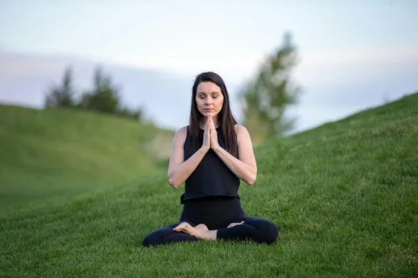 a woman meditate with austin meditation